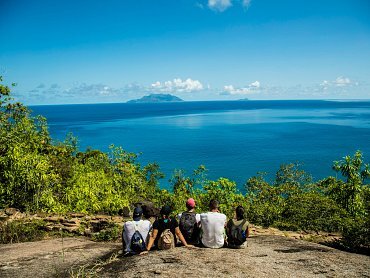 VISITORS ADMIRING VIEW FROM ANSE MAJOR VIEWPOINT